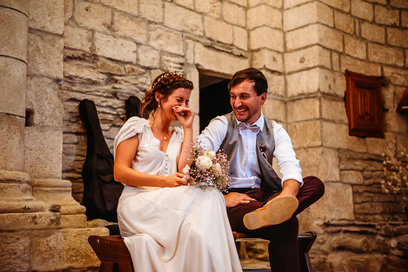 wedding couple during their ceremony smiling with west sussex weddings photographer