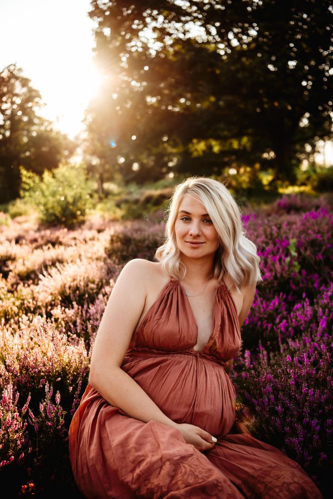 Pregnant women posing to the camera on a pregnancy photoshoot in Pulborough, West Sussex