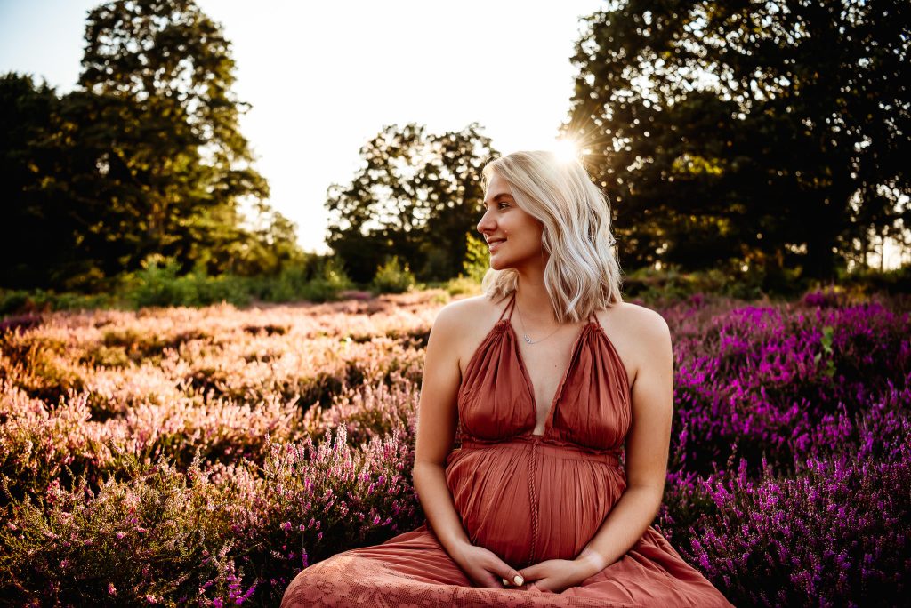 pregnant women looking to the side during sunset maternity photography