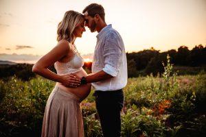 couple with heads together expecting a baby with Vanessa Gomes photography