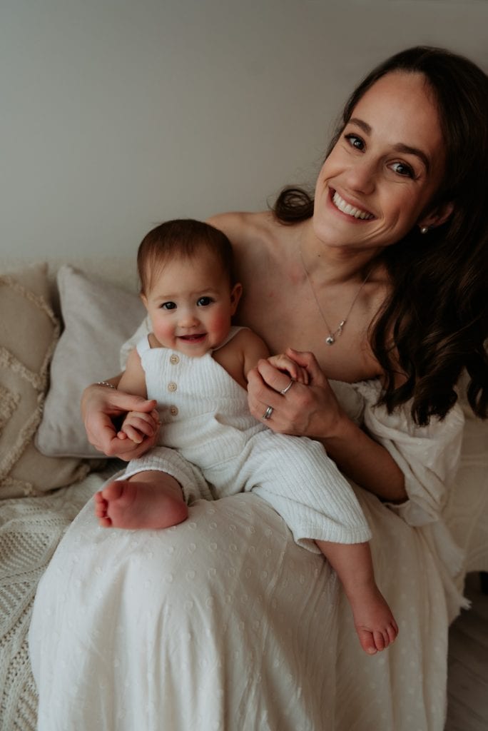 mum and baby looking at the camera and smilling