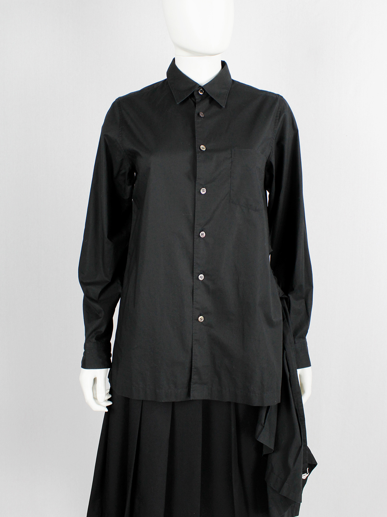 Comme des Garçons tricot black shirt with pleated peplum on the 