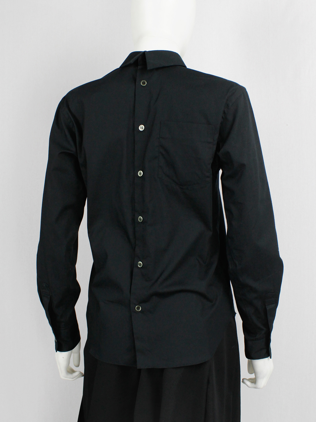 Comme des Garçons BLACK black button-up shirt worn backwards — AD