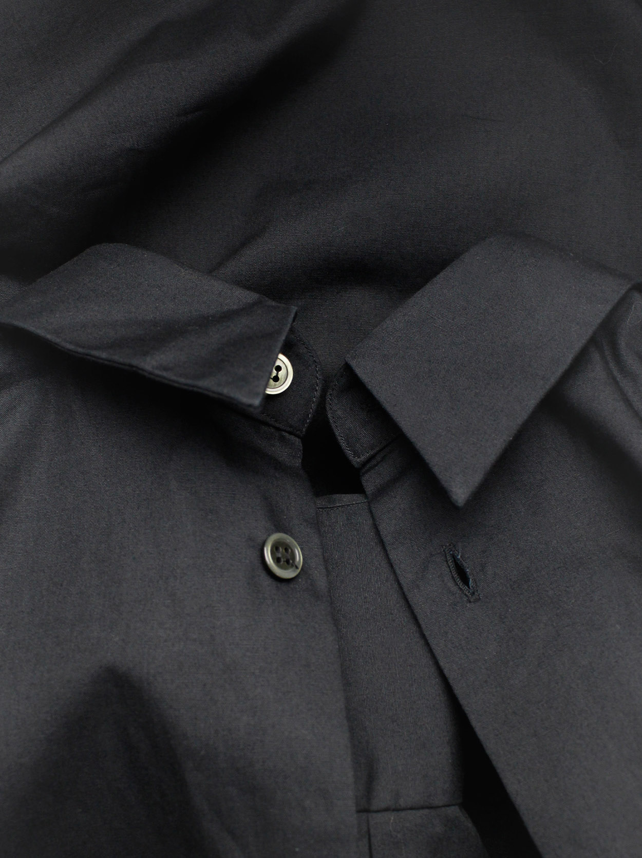 Comme des Garçons BLACK black button-up shirt worn backwards — AD Comme des Garçons BLACK black button-up shirt worn backwards — AD