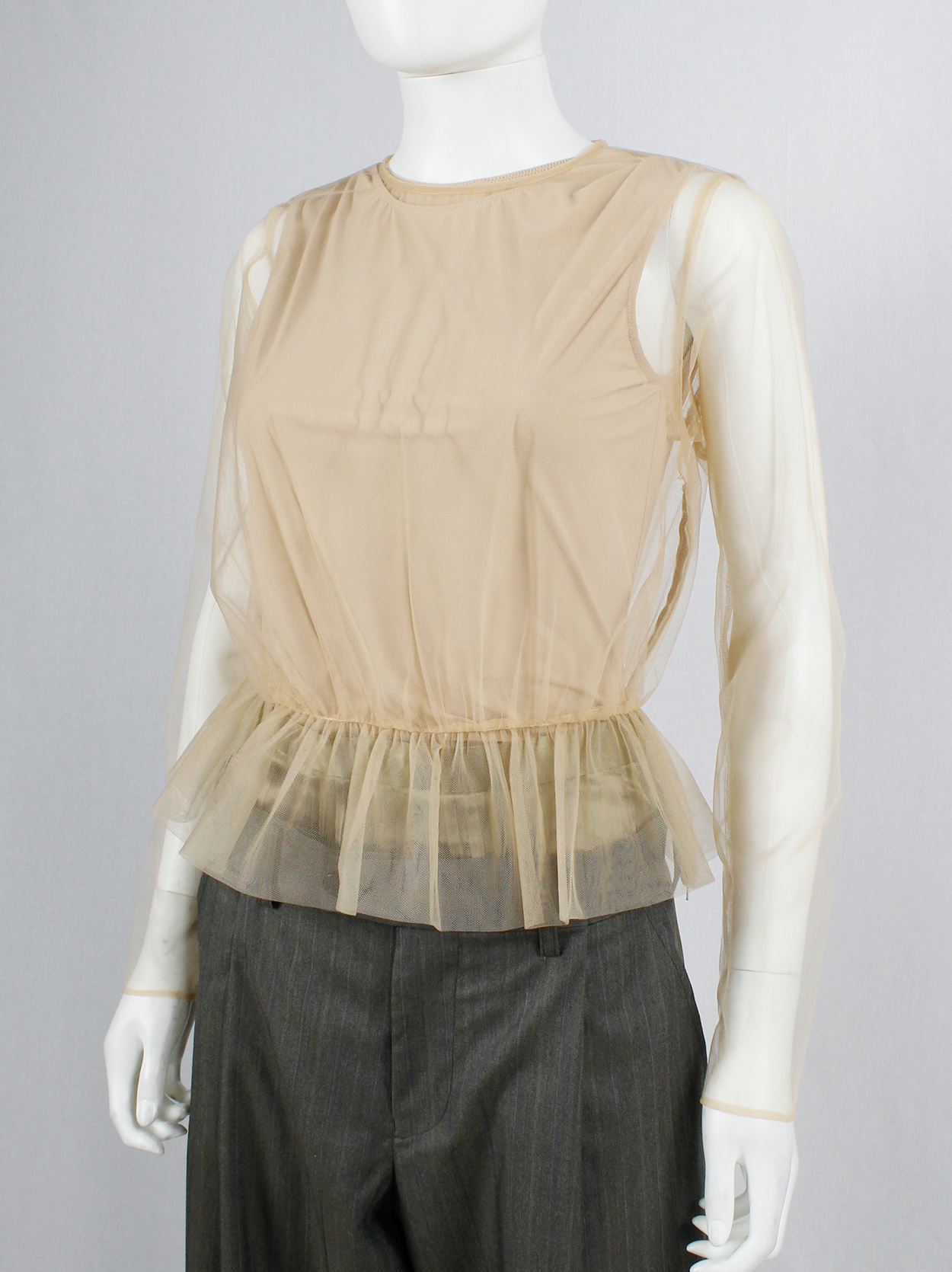 Noir Kei Ninomiya beige sheer jumper with gathered peplum Noir Kei Ninomiya beige sheer jumper with gathered peplum