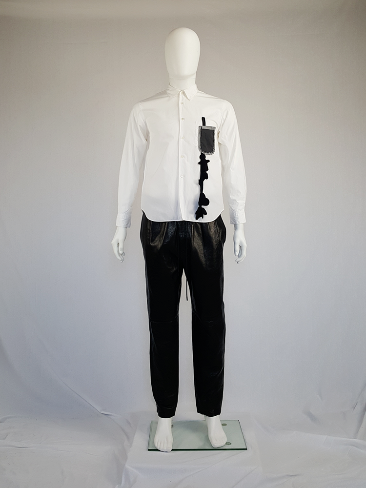 Comme des Garçons Homme Plus white shirt with hanging dolls