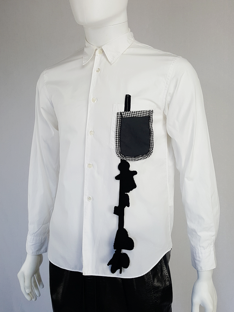 Comme des Garçons Homme Plus white shirt with hanging dolls