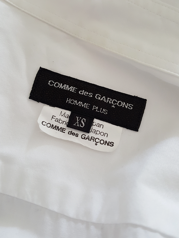 Comme des Garçons Homme Plus white shirt with hanging dolls