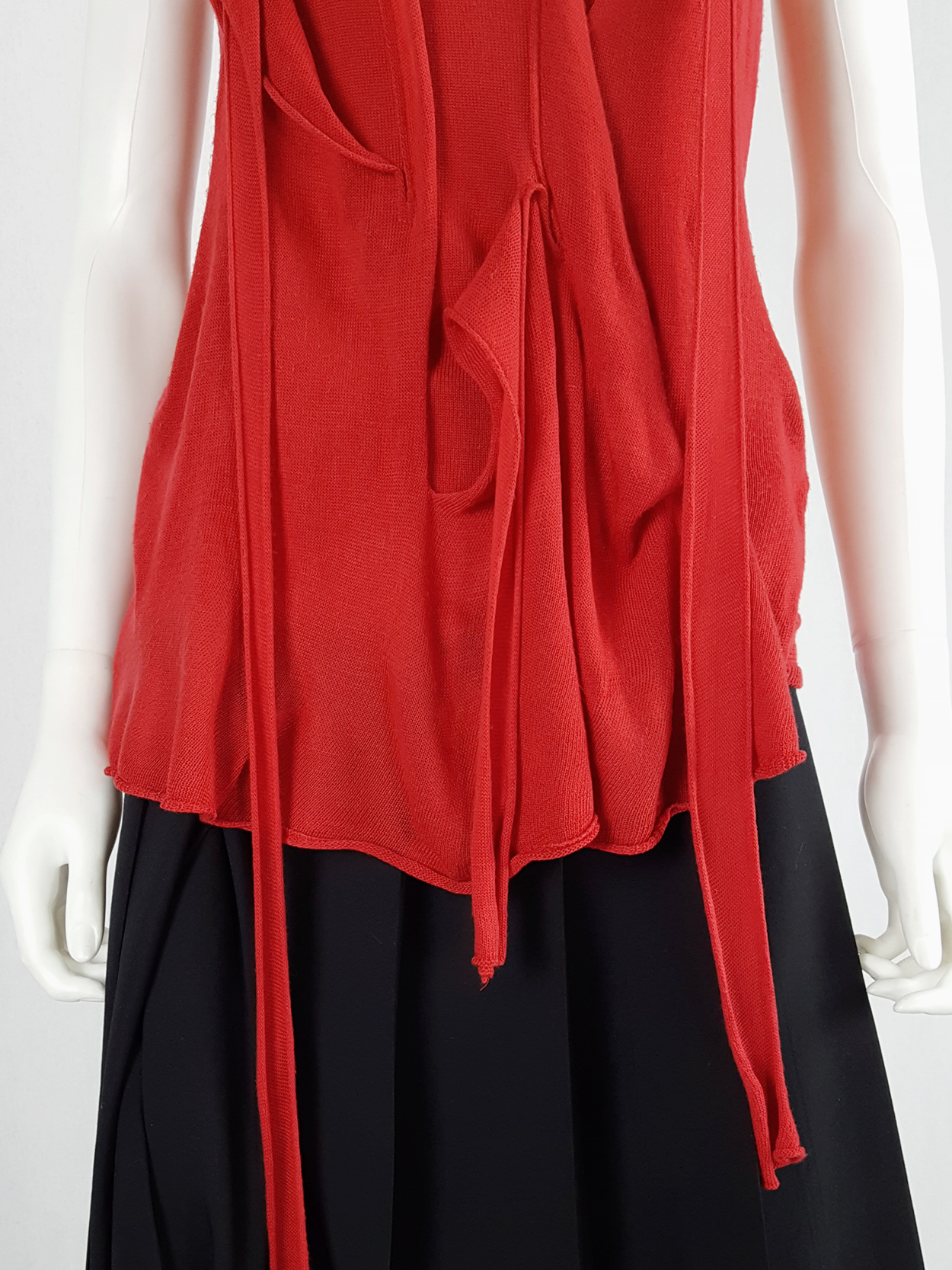 Comme des Garçons red knit top with long strips — spring 2015 