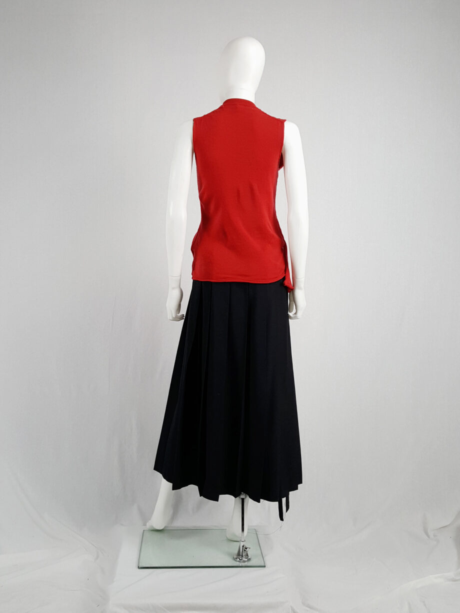 Comme des Garçons red knit top with long strips — spring 2015