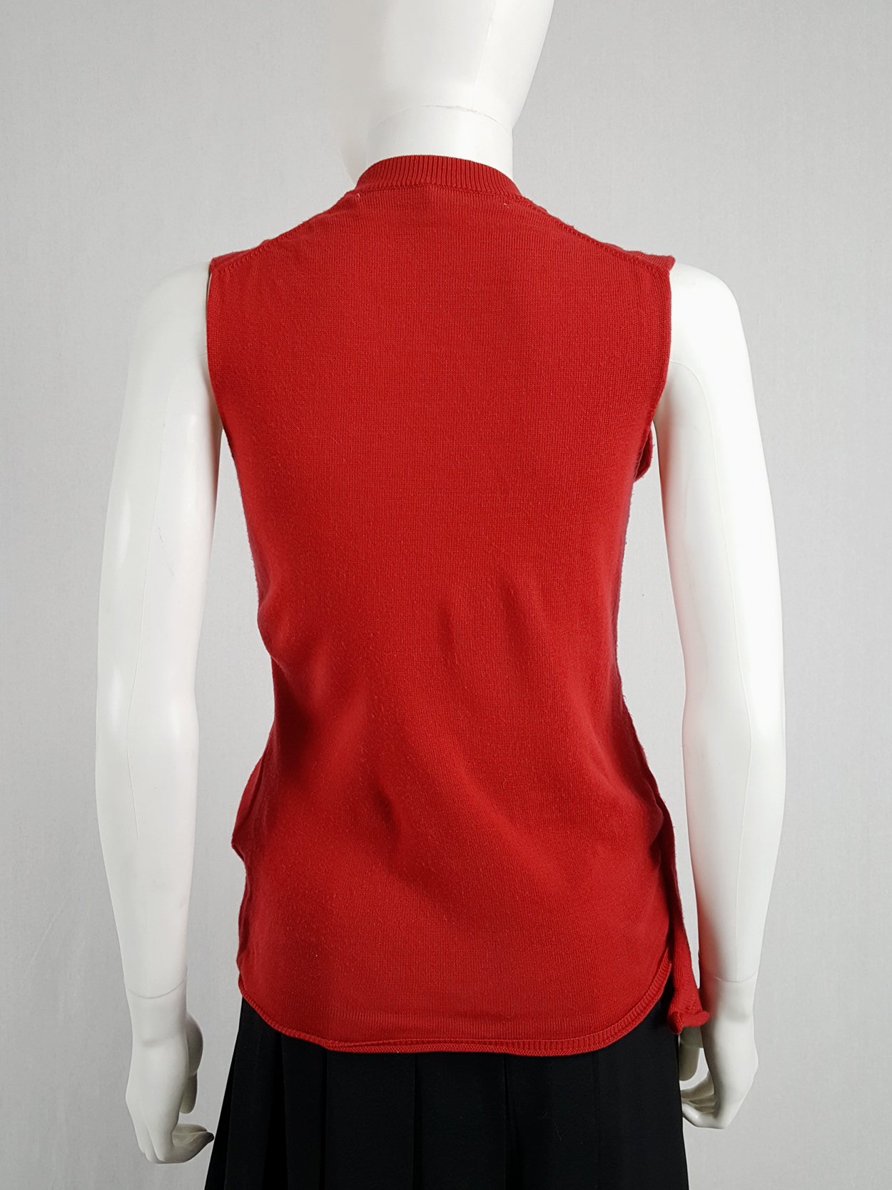 Comme des Garçons red knit top with long strips — spring 2015 