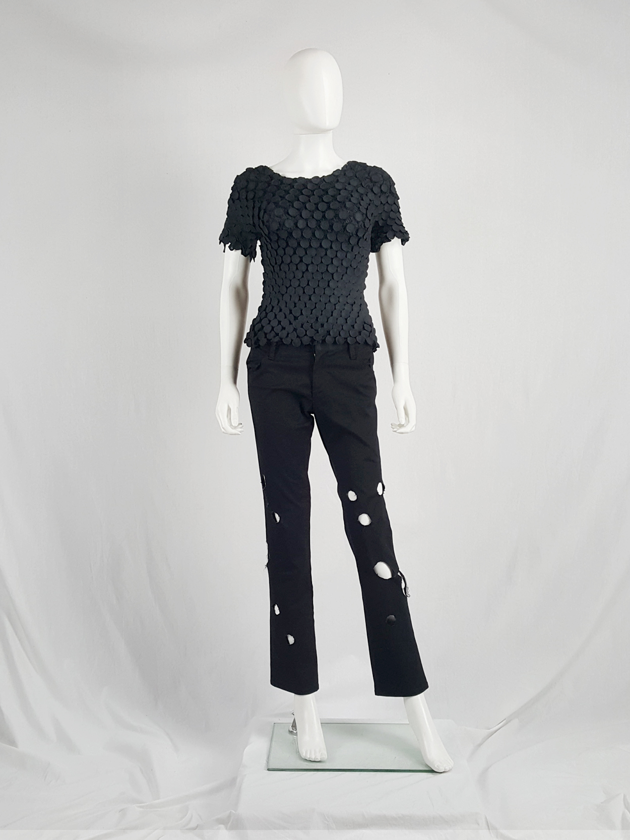 Issey Miyake black t-shirt with the fabric manipulated into 3D 