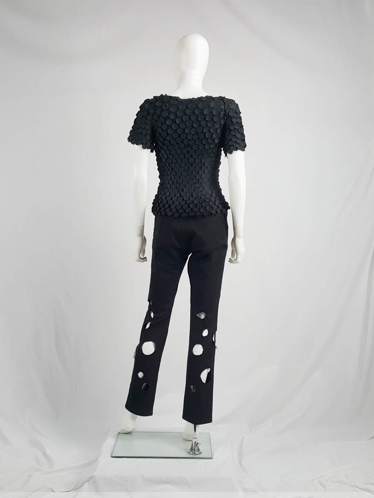 Issey Miyake black t-shirt with the fabric manipulated into 3D 