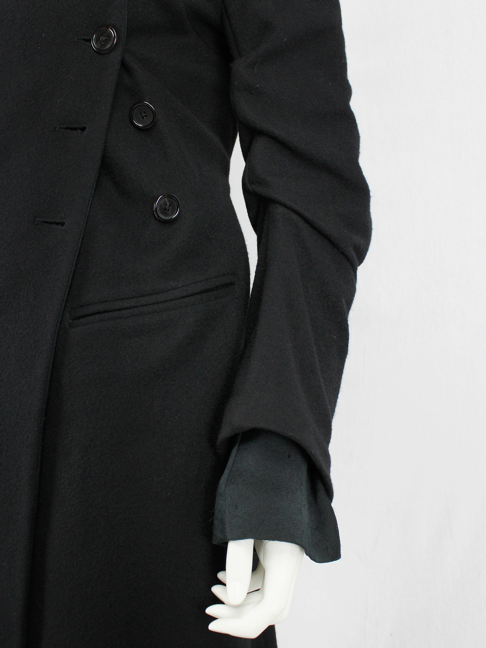 Ann Demeulemeester black long coat with asymmetric button closure