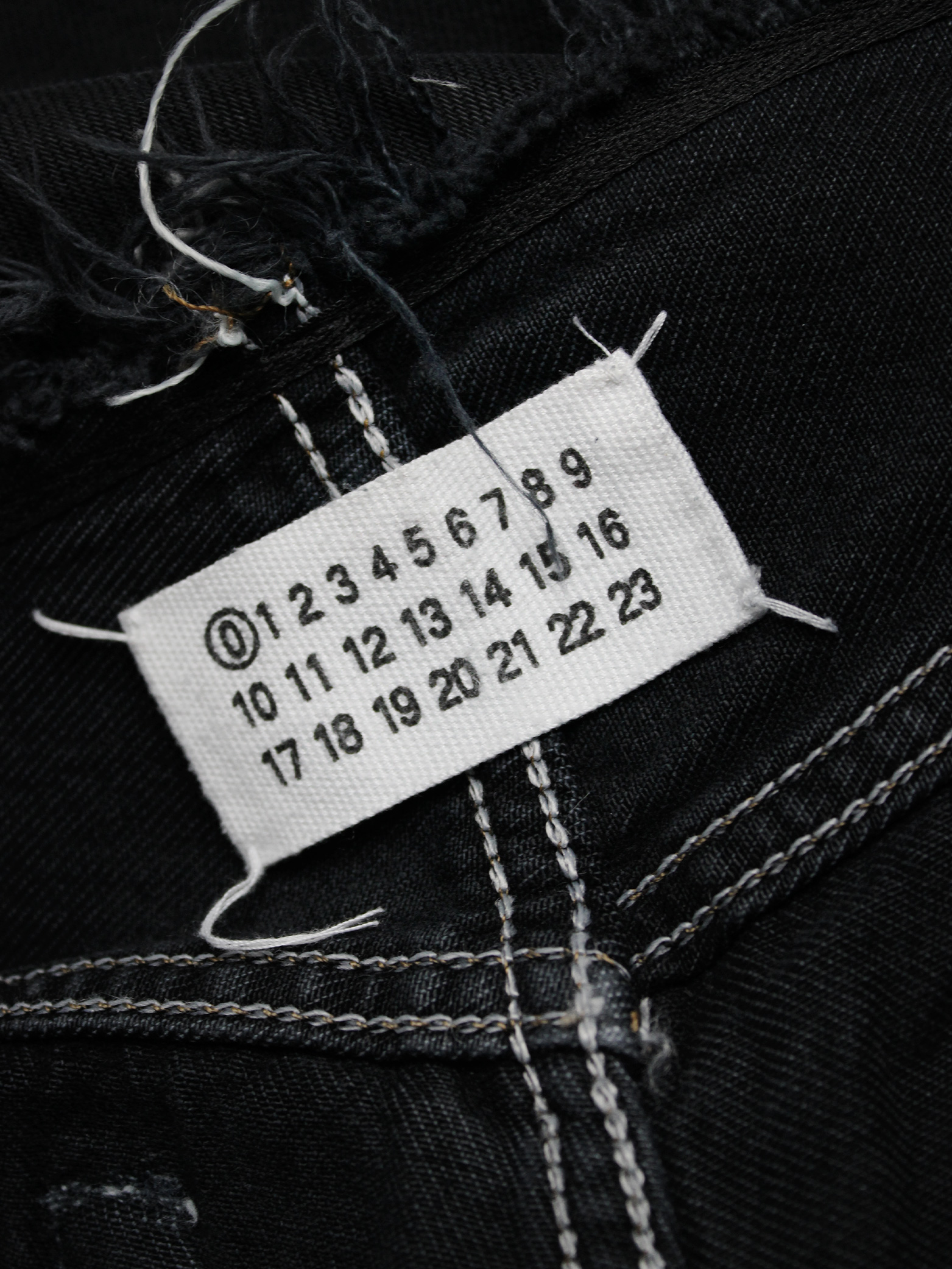 Maison Martin Margiela artisanal denim trousers with cut-off waist 