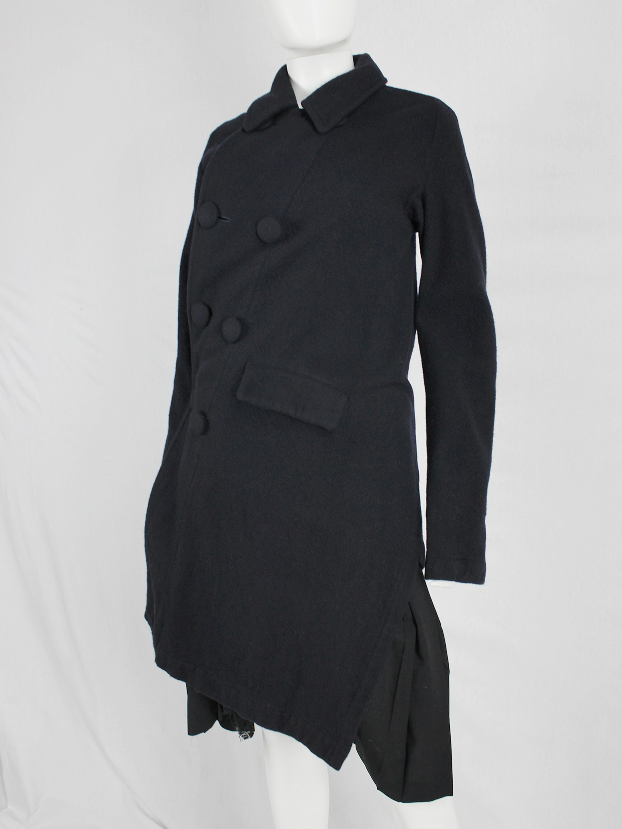 Comme des Garçons Comme blue coat twisting around the body