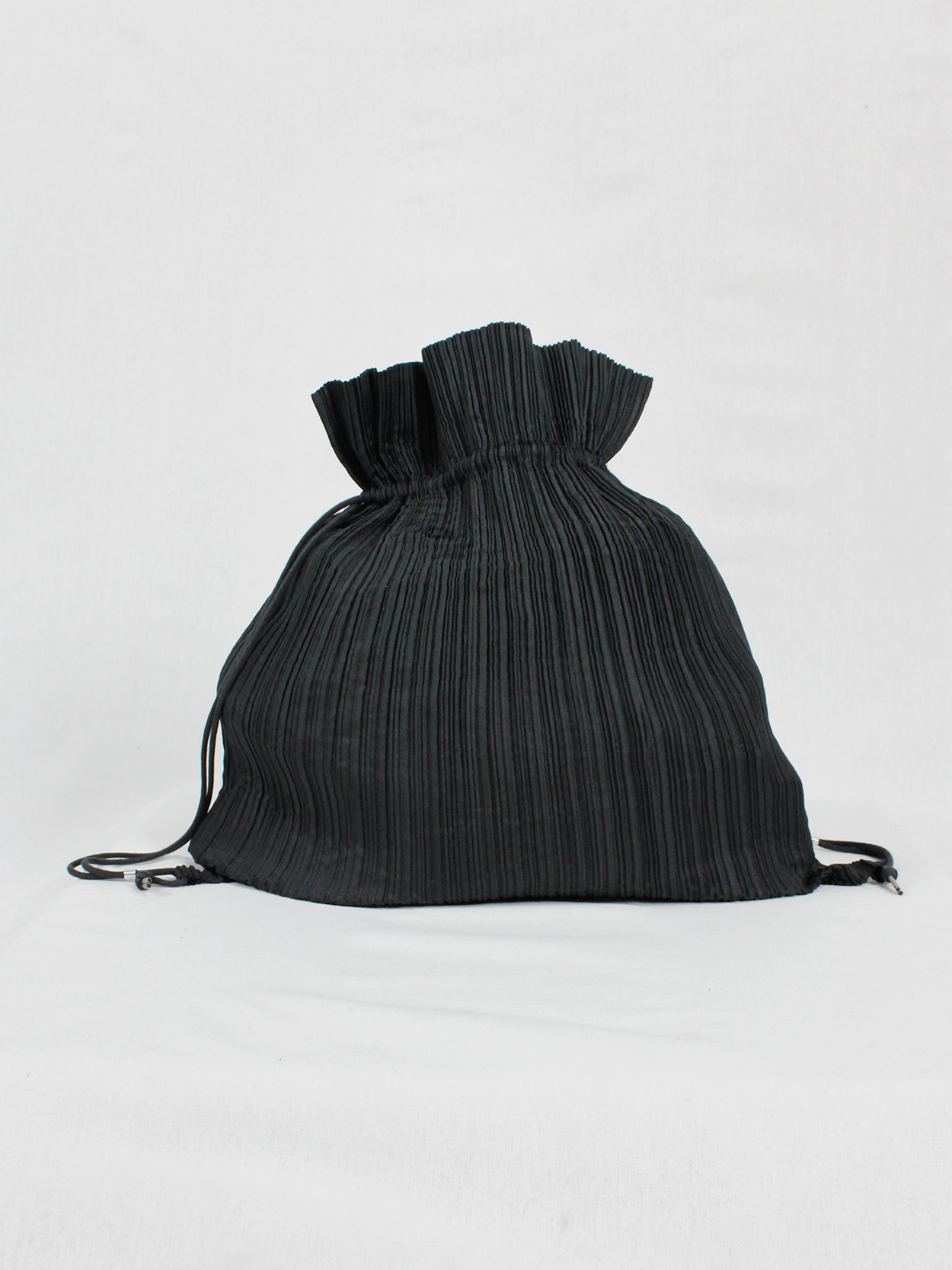 Issey Miyake black pleated drawstring backpack - VANIITAS  display picture 3