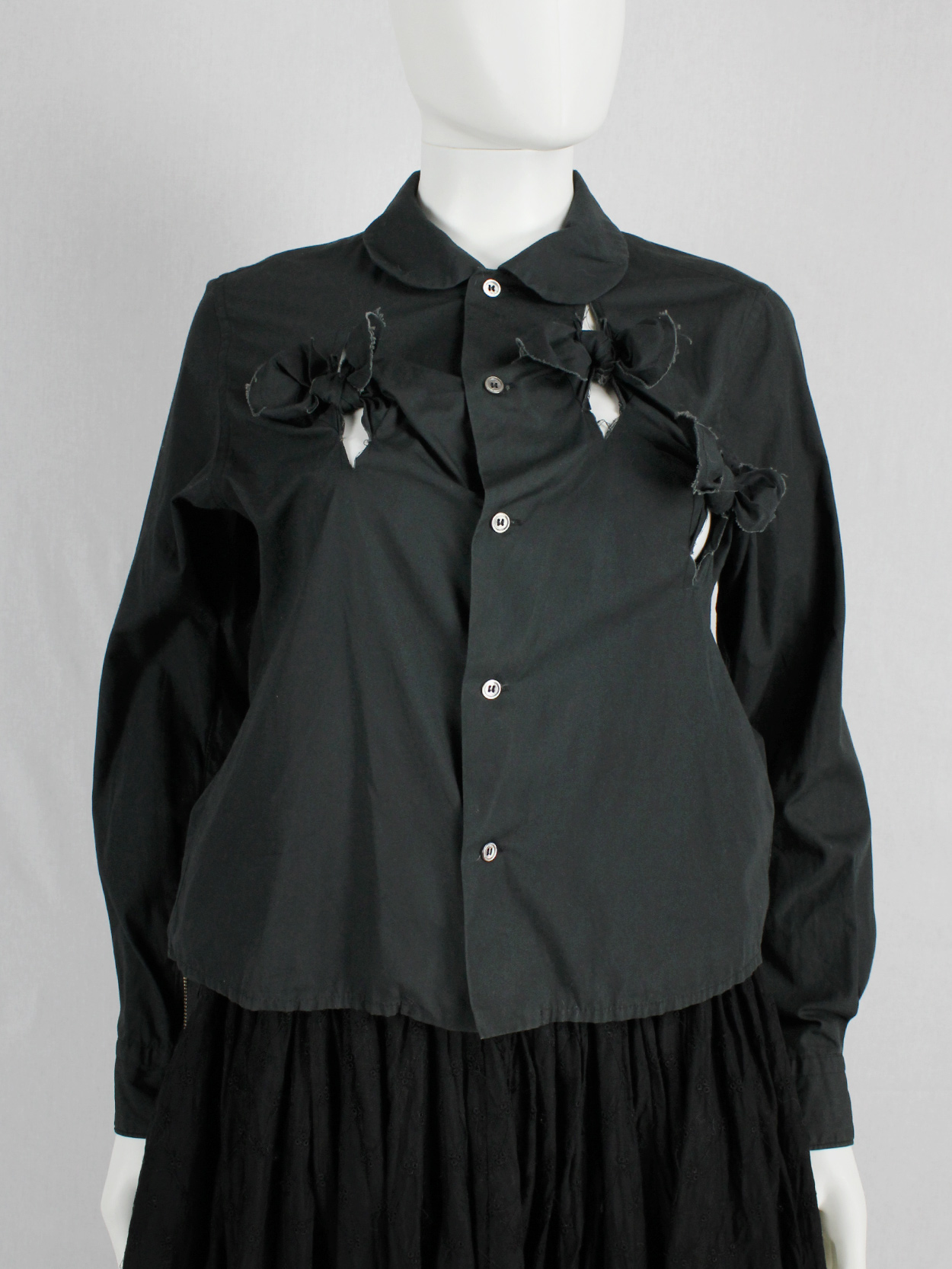 Comme des Garçons black shirt with slits and three bows — spring 