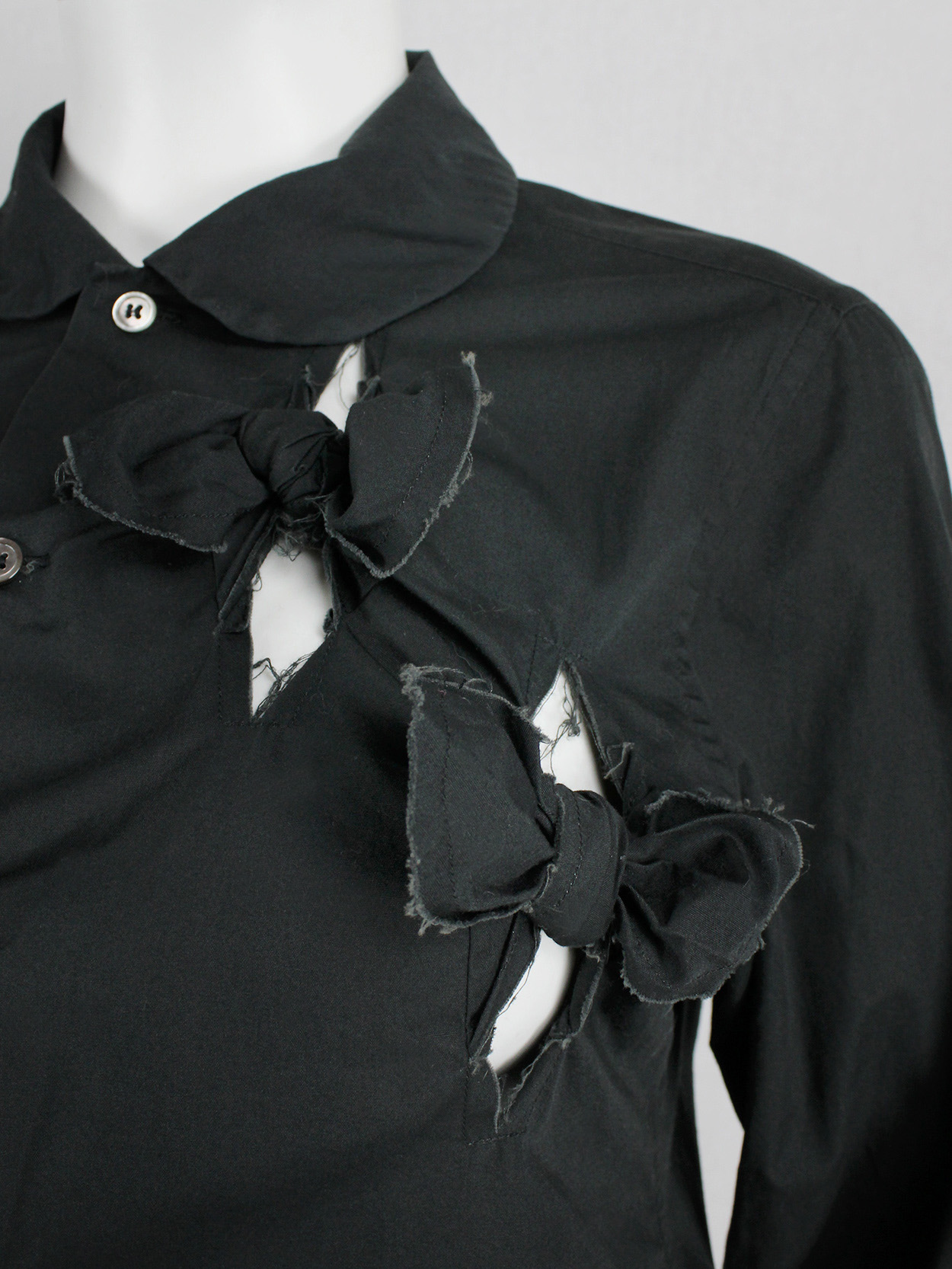 Comme des Garçons black shirt with slits and three bows — spring 