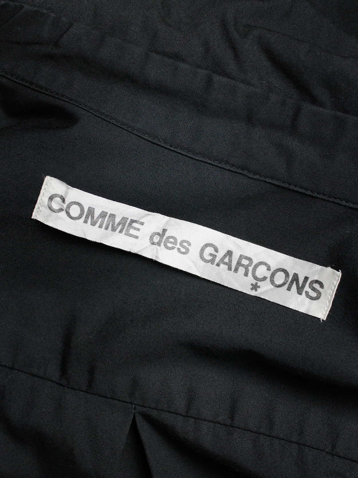 Comme des Garçons black shirt with slits and three bows — spring 