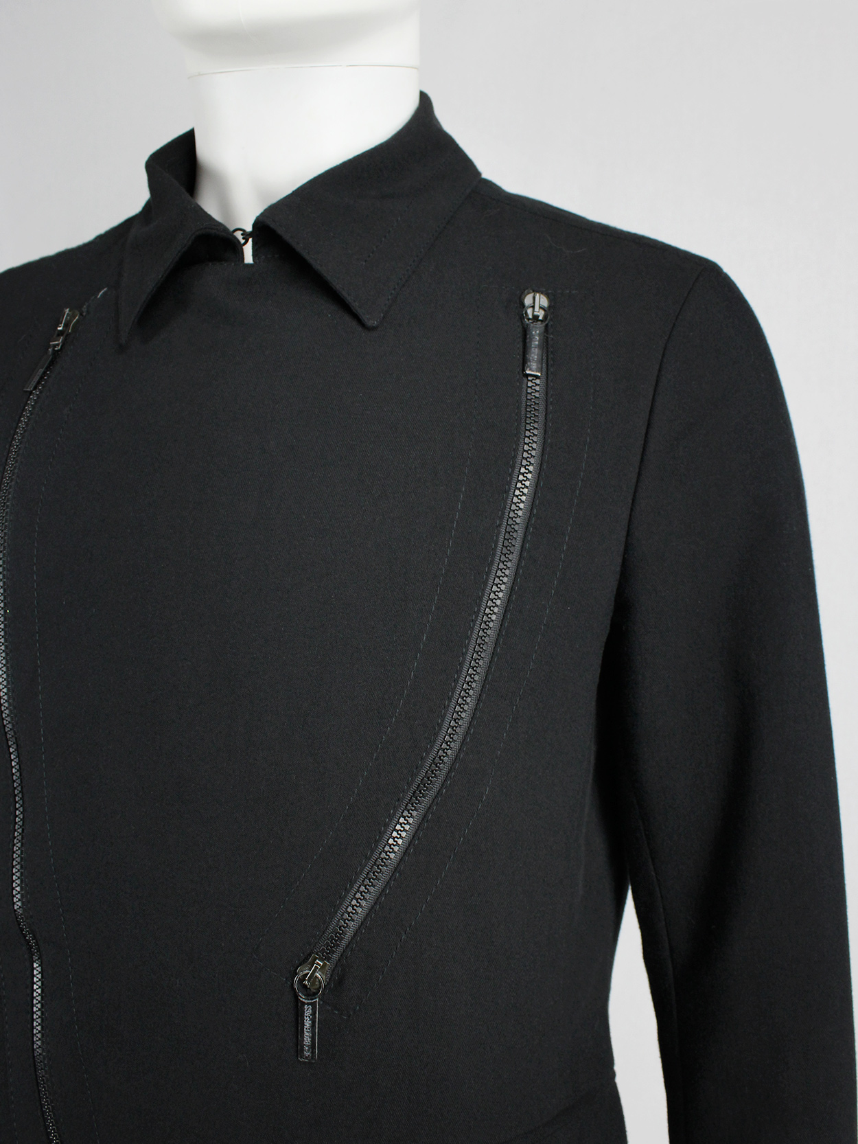 Dirk Bikkembergs dark blue coat with curved zippers — fall 2003 