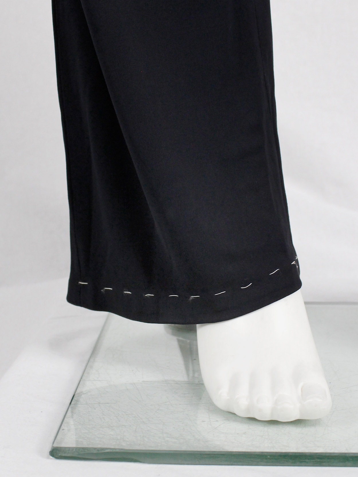 Maison Martin Margiela dark blue trousers with white exposed 