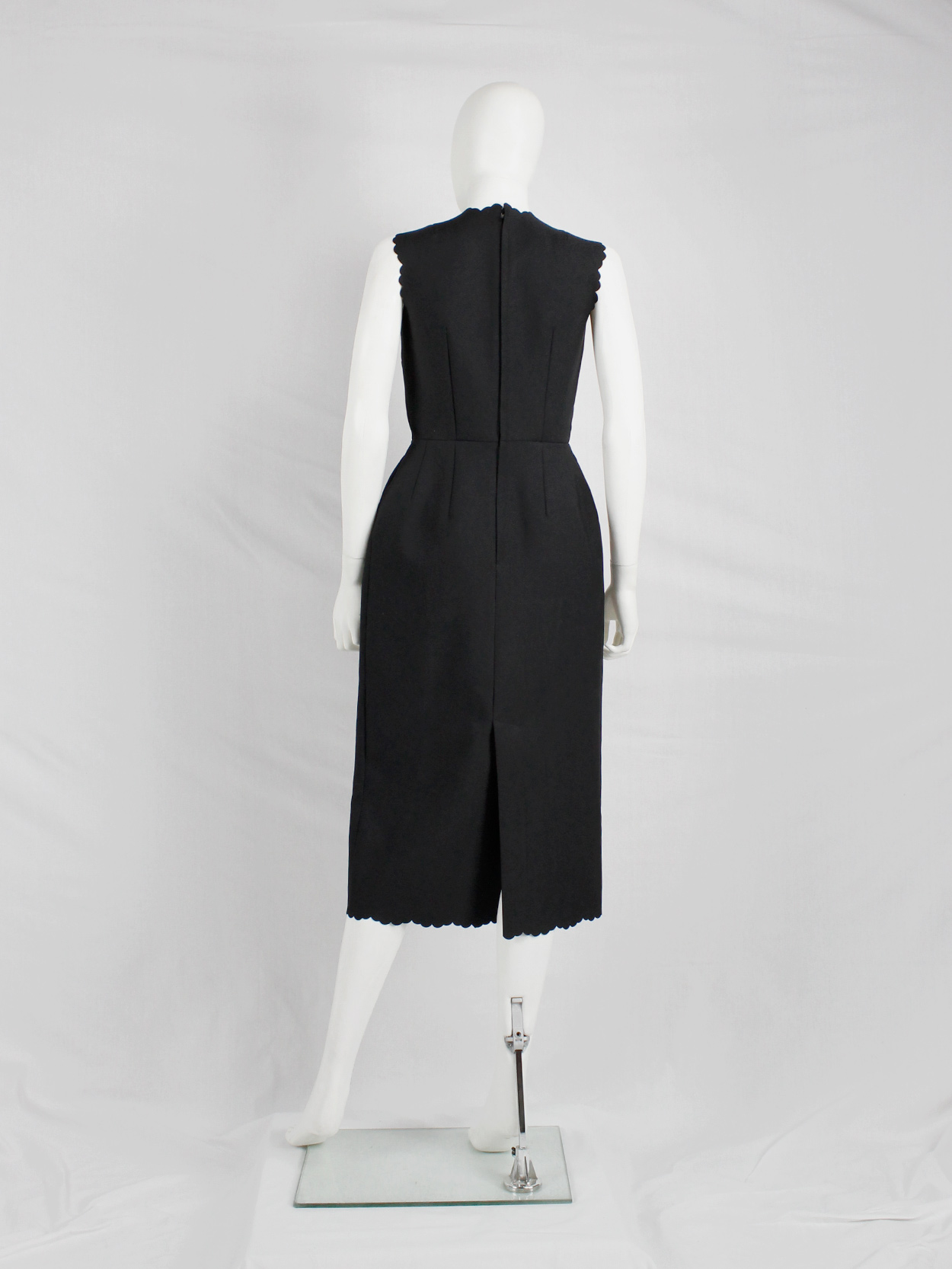 Comme des Garçons black dress with scalloped edges and wider hips 
