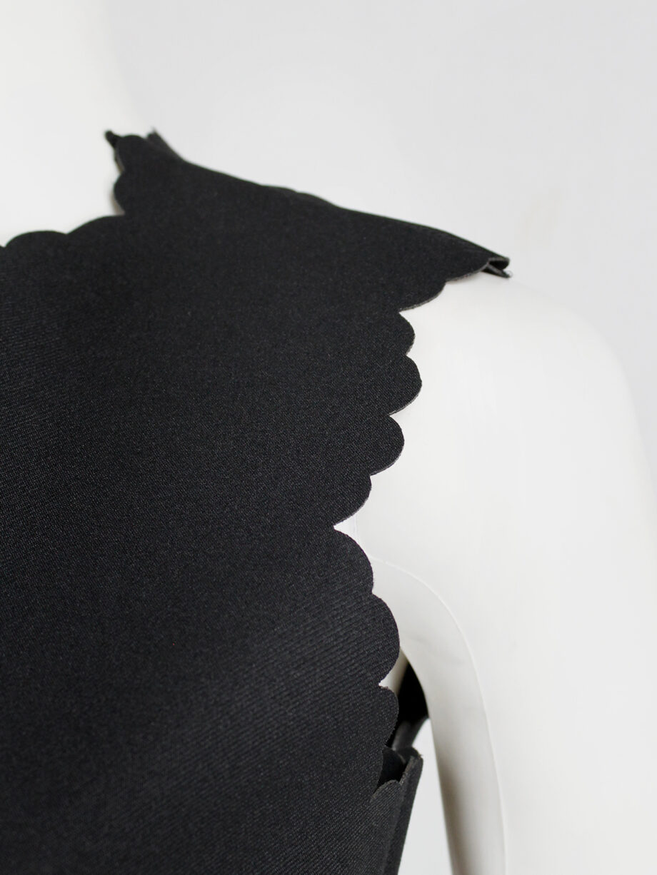Comme des Garçons black dress with scalloped edges and wider hips