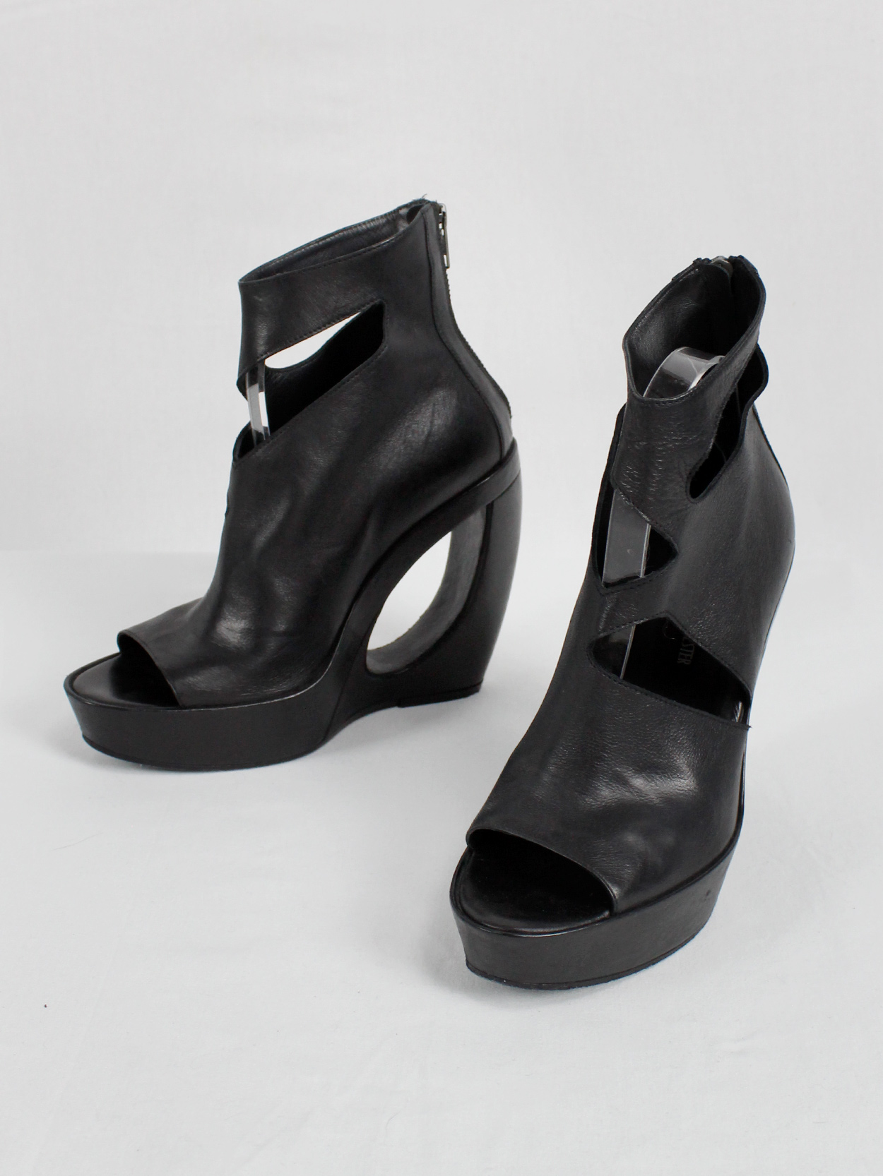 Ann Demeulemeester black platform boots with cut-out curved heel 