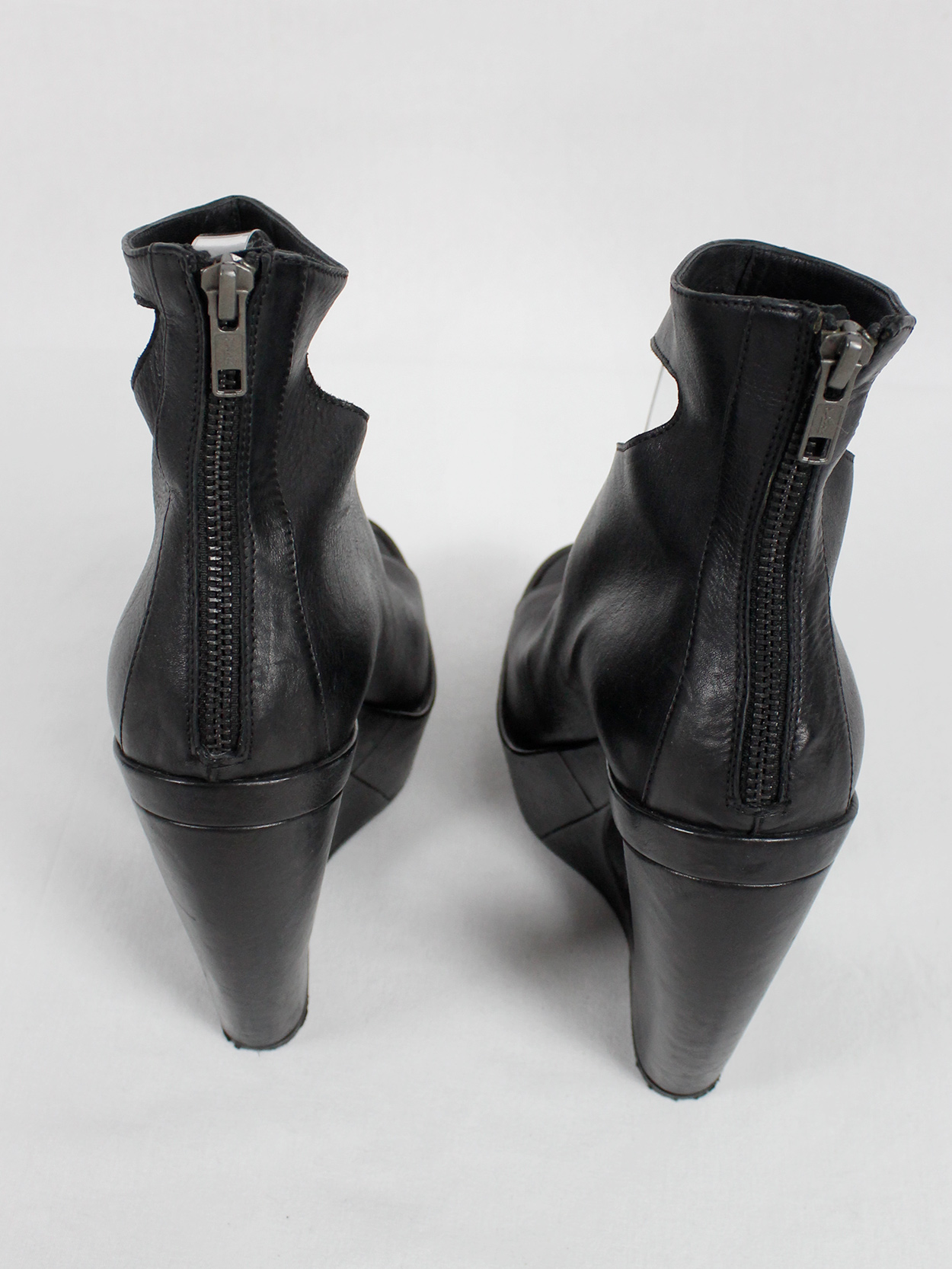 Ann Demeulemeester black platform boots with cut-out curved heel 