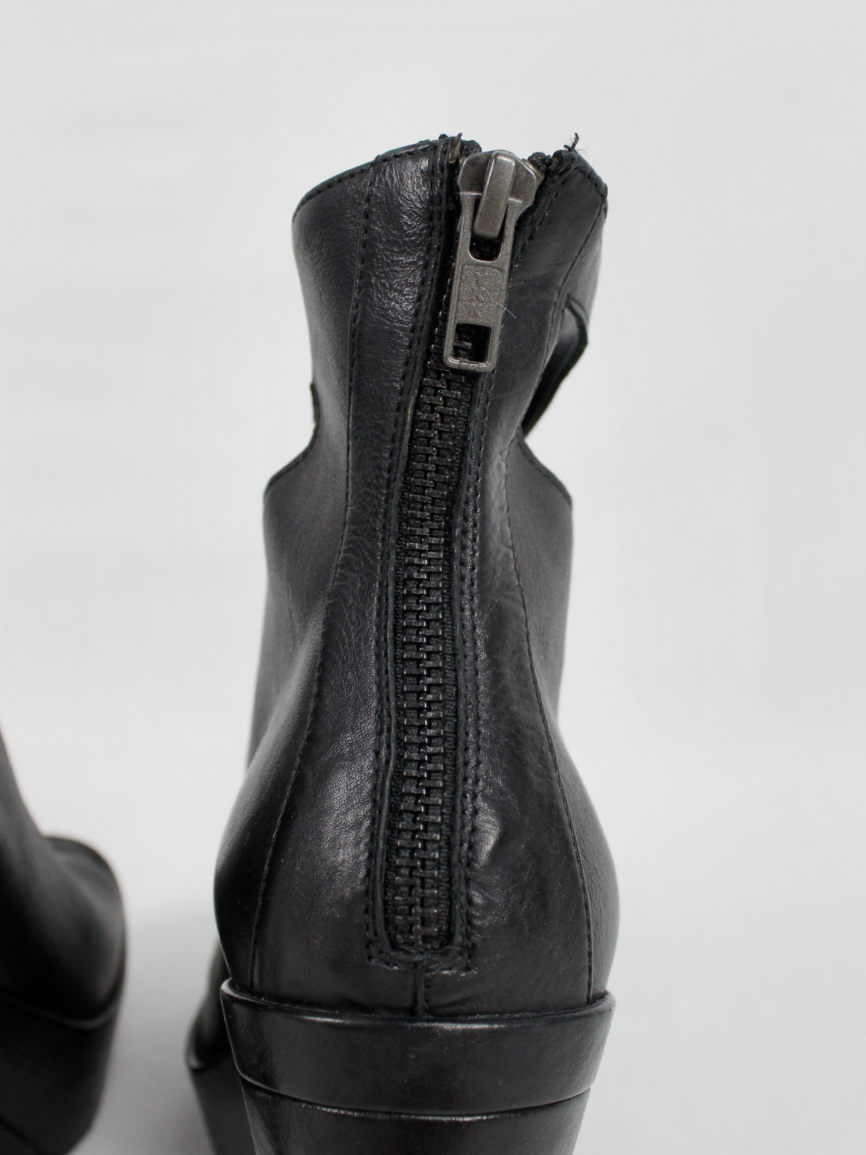 Ann Demeulemeester black platform boots with cut-out curved heel