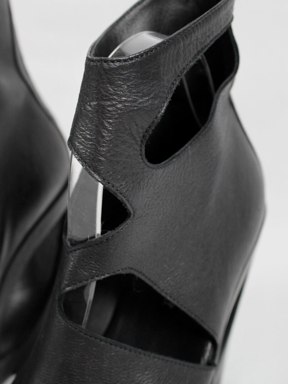 Ann Demeulemeester black platform boots with cut-out curved heel