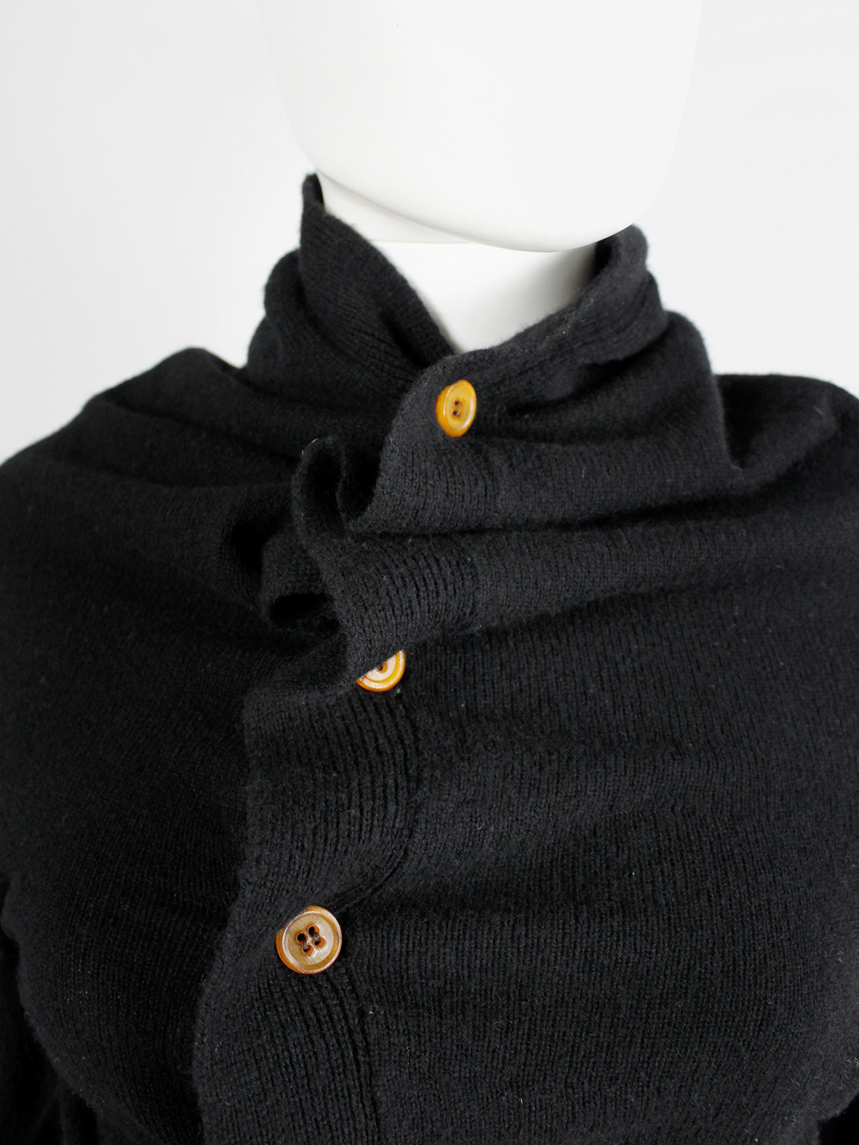 Comme des Garçons black circular cardigan with orange buttons and 