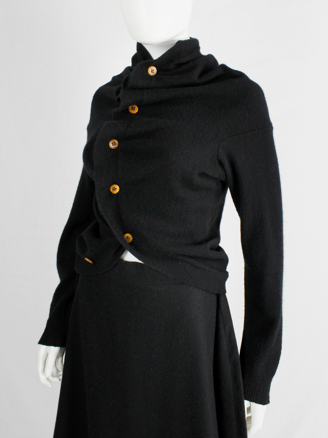 Comme des Garçons black circular cardigan with orange buttons and 