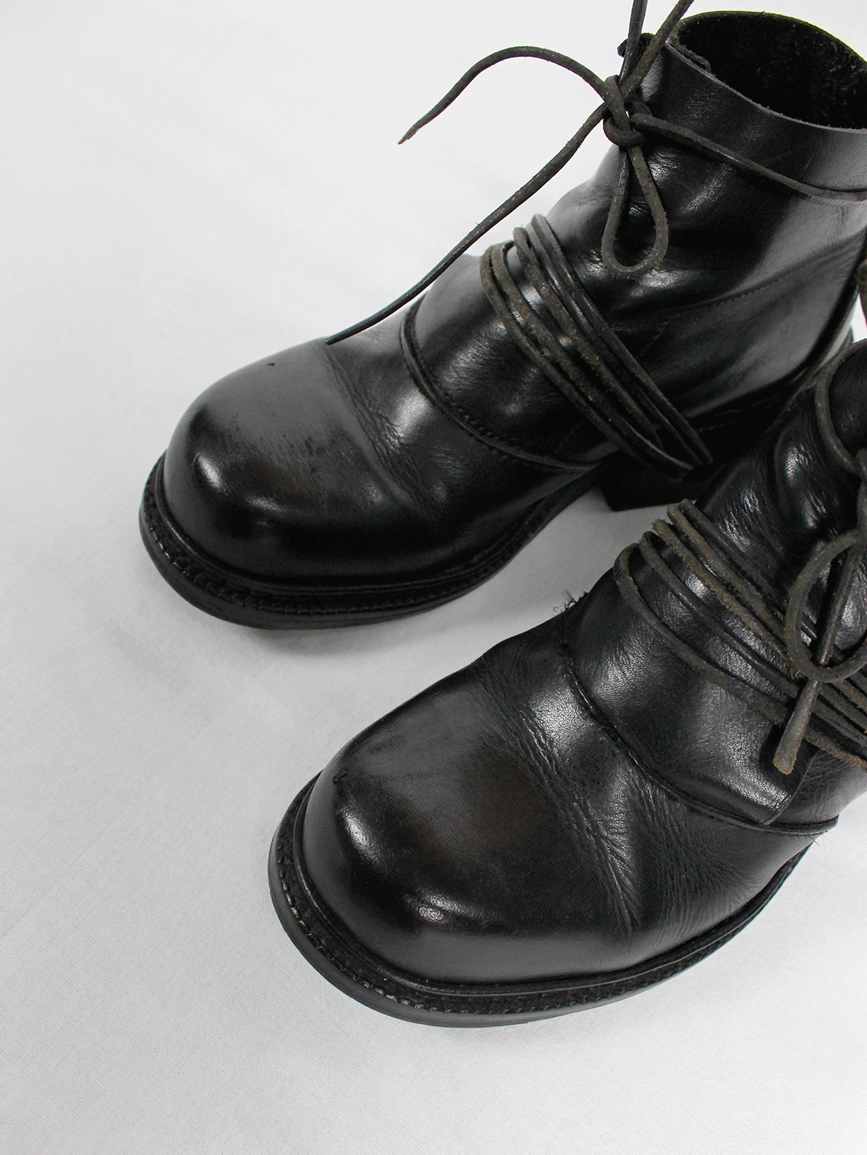 Dirk Bikkembergs black boots with flap and laces through the soles