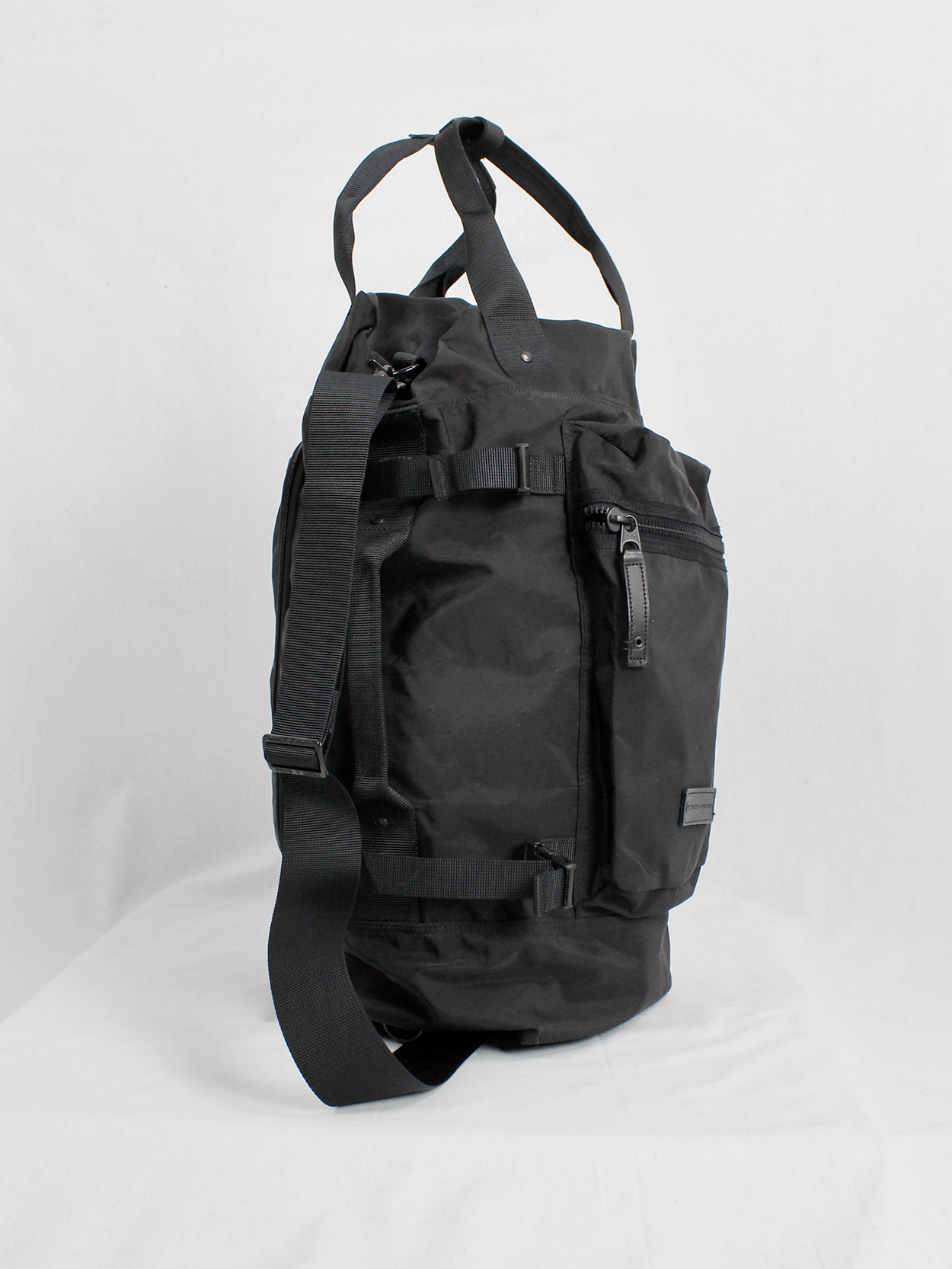 Y'SACCS Pour Tous black duffle bag with utility straps — 1990's