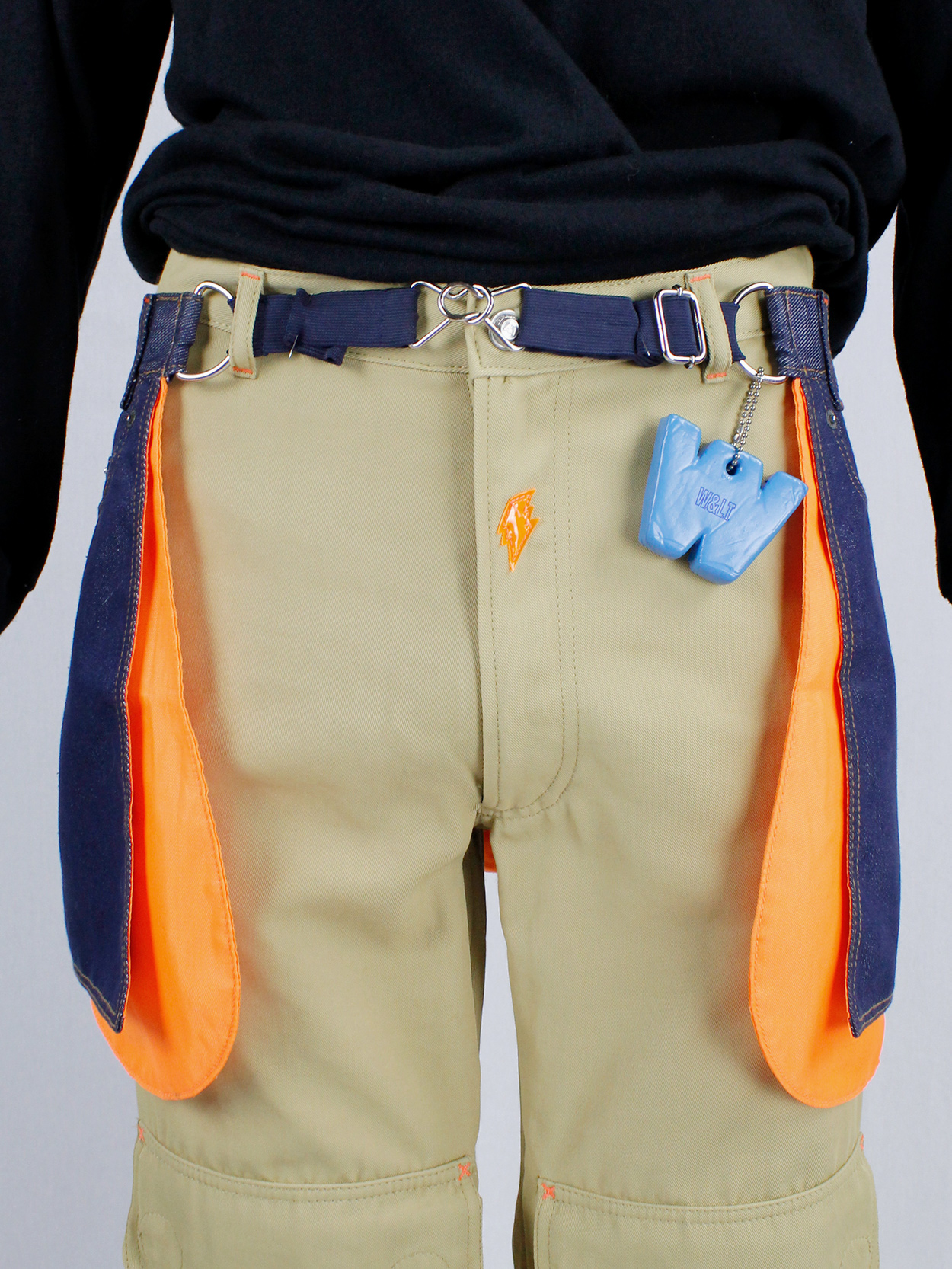 Walter Van Beirendonck W&LT denim trousers as a belt with neon 