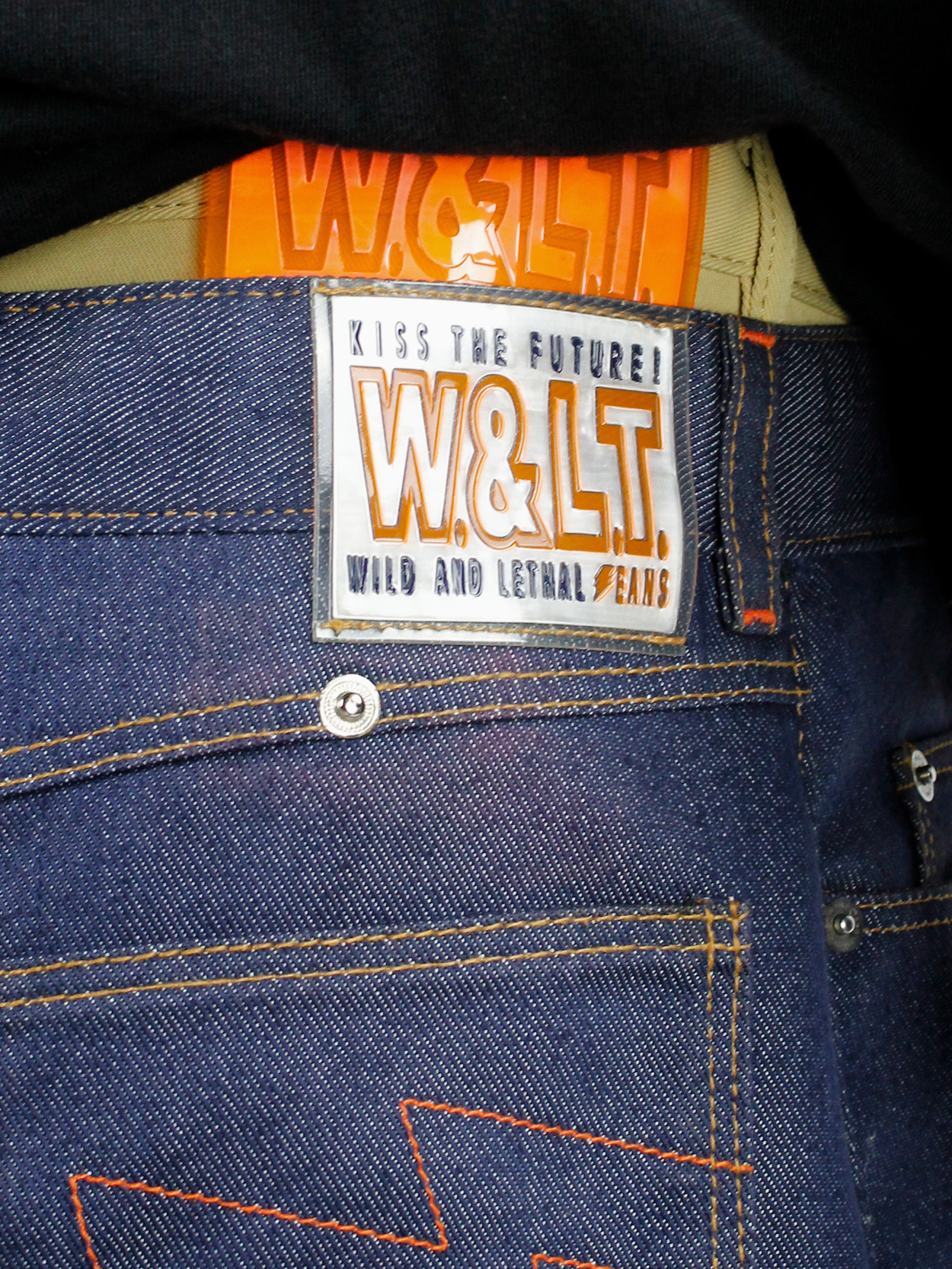 Walter Van Beirendonck W&LT denim trousers as a belt with neon 