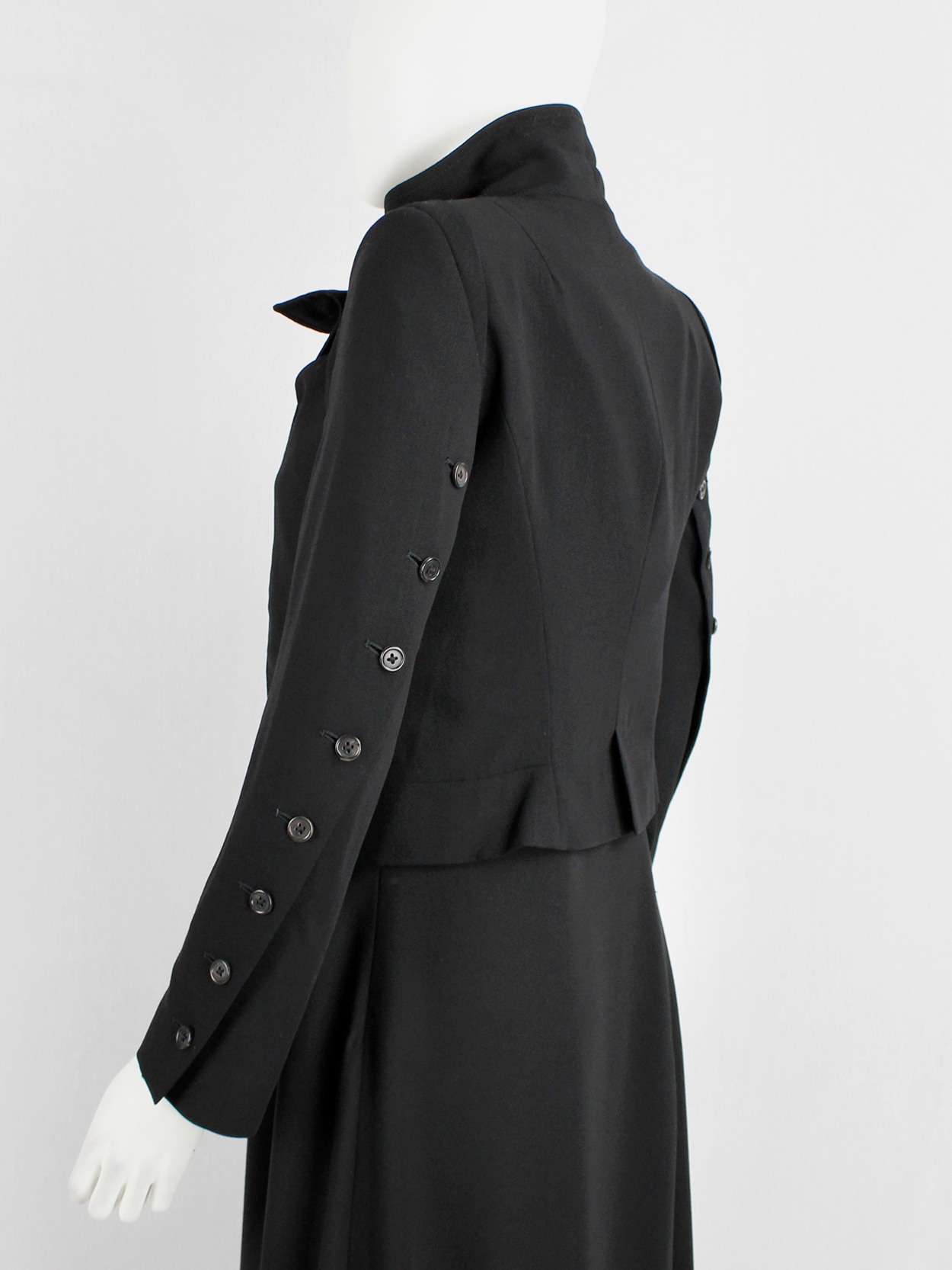Ann Demeulemeester black jacket with buttons twisting around the 
