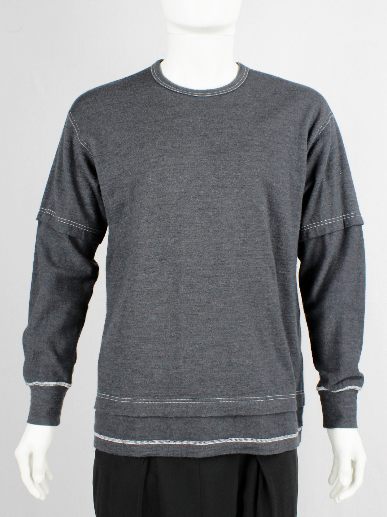 Comme des Garçons Homme grey jumper with a t-shirt layered over it 