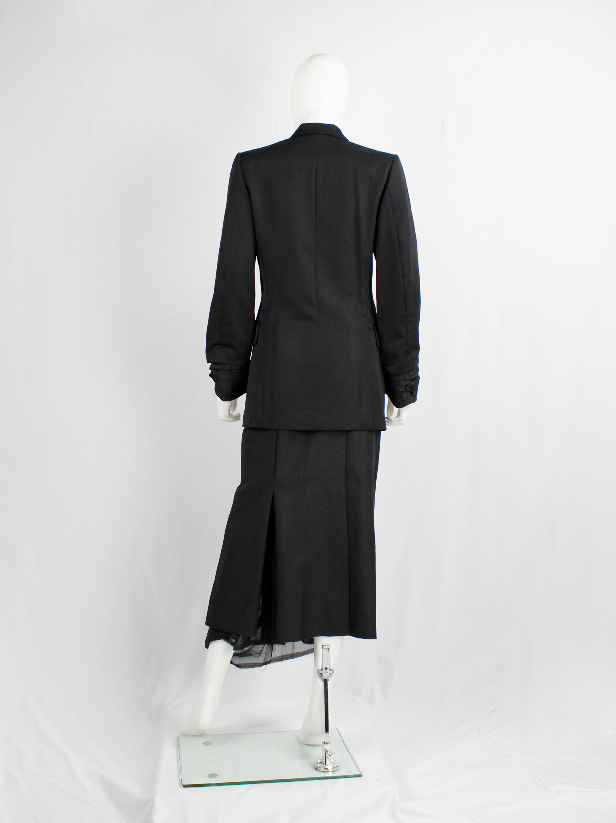 Comme des Garçons black blazer with scrunched lining coming out of
