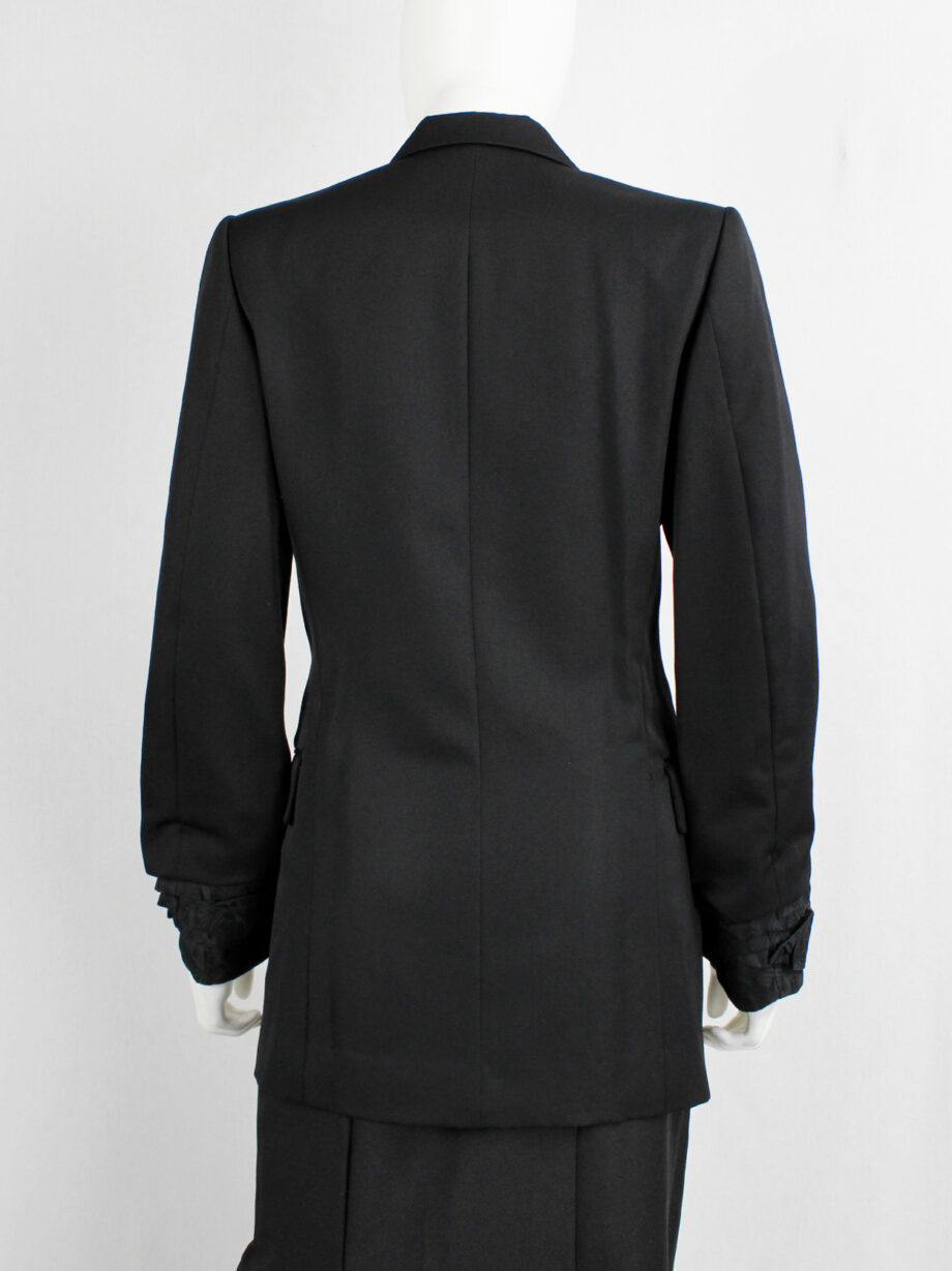 Comme des Garçons black blazer with scrunched lining coming out of