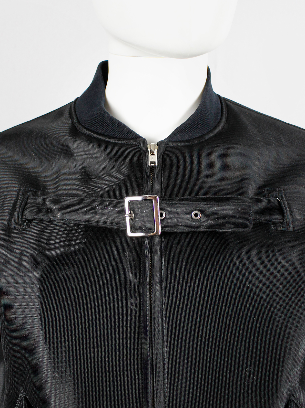 Noir Kei Ninomiya black bomber jacket with belted strap across the