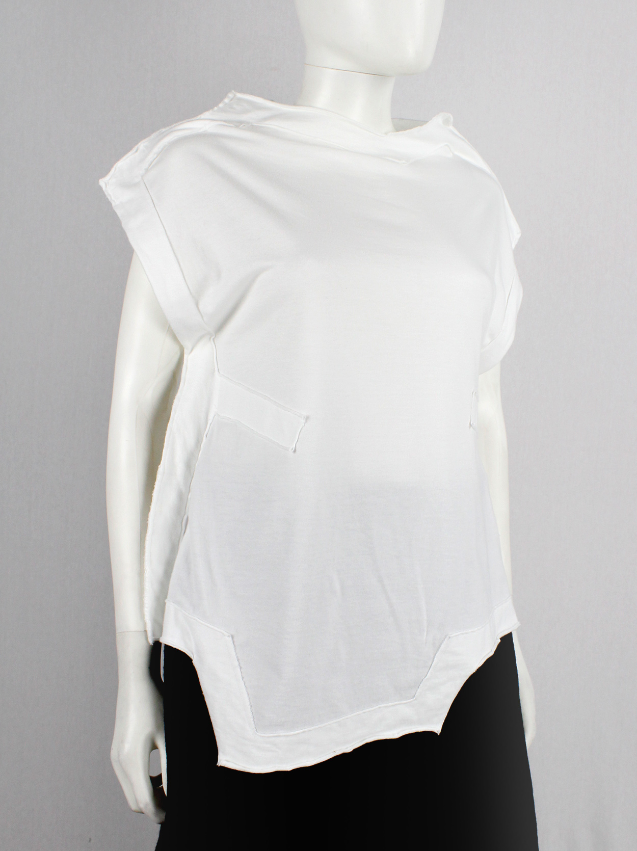 Comme des Garçons white geometric two-dimensional paperdoll Comme des Garçons white geometric two-dimensional paperdoll