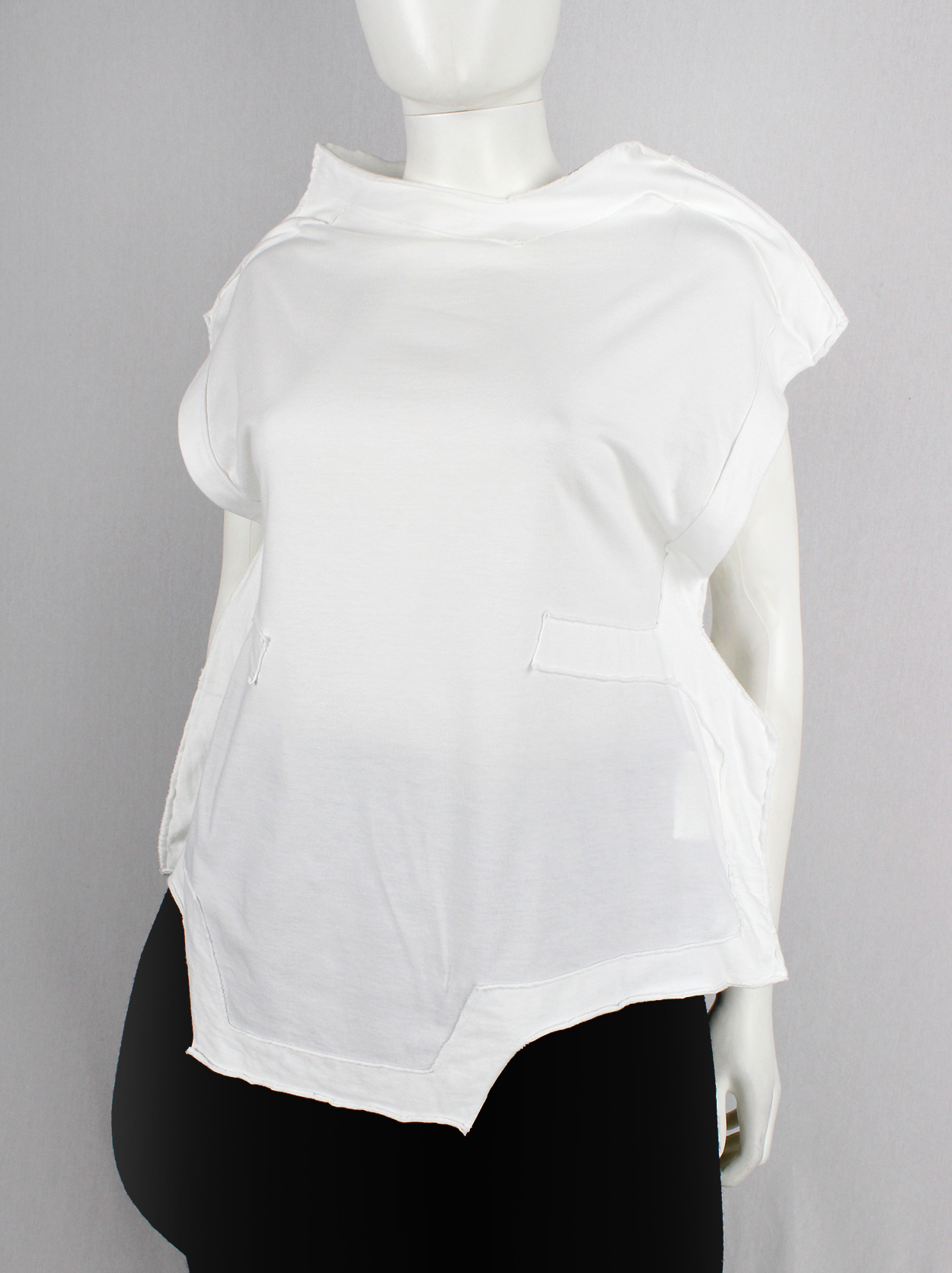 Comme des Garçons white geometric two-dimensional paperdoll Comme des Garçons white geometric two-dimensional paperdoll