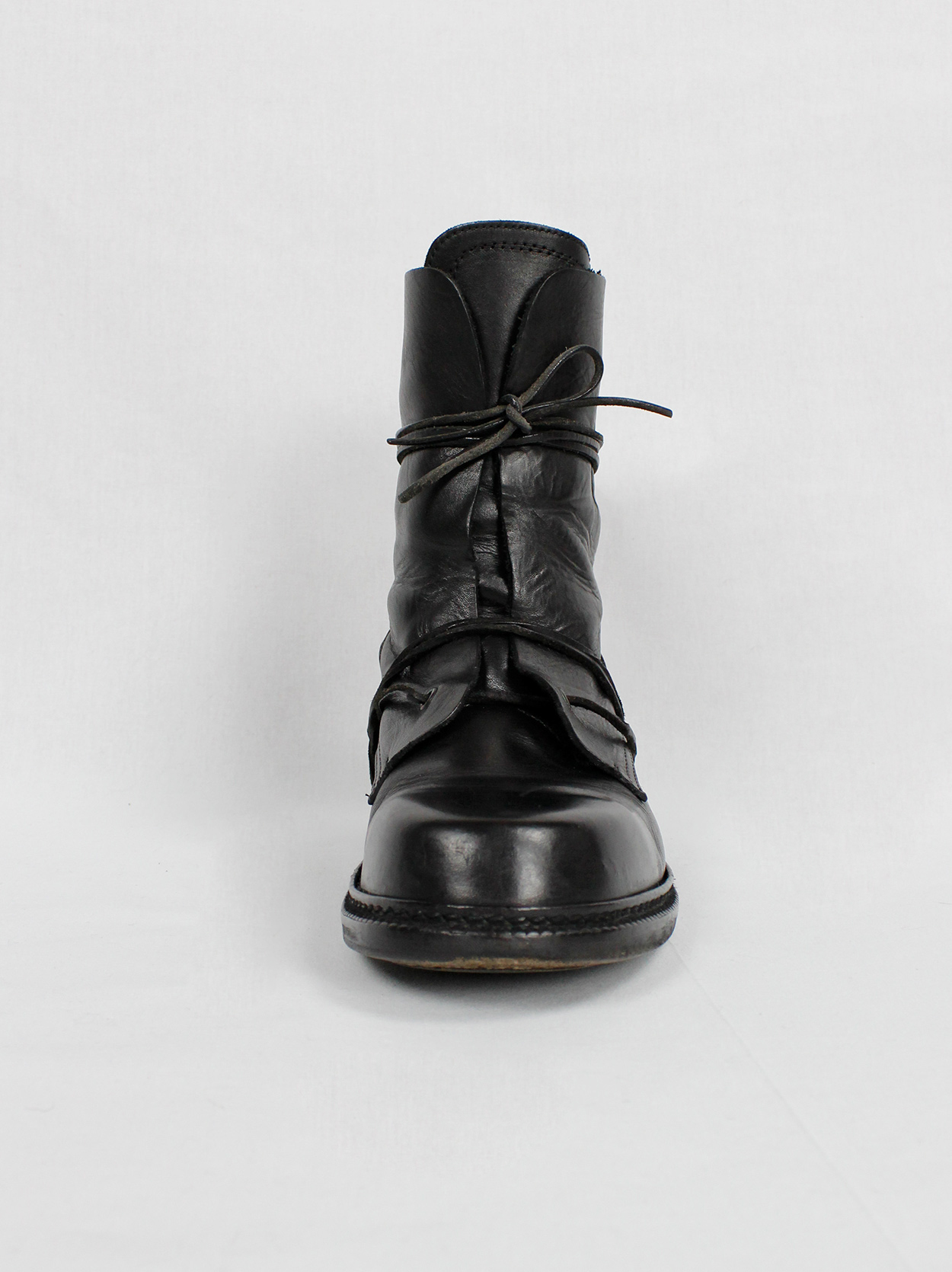 Dirk Bikkembergs black combat boots wrapped with laces through the 