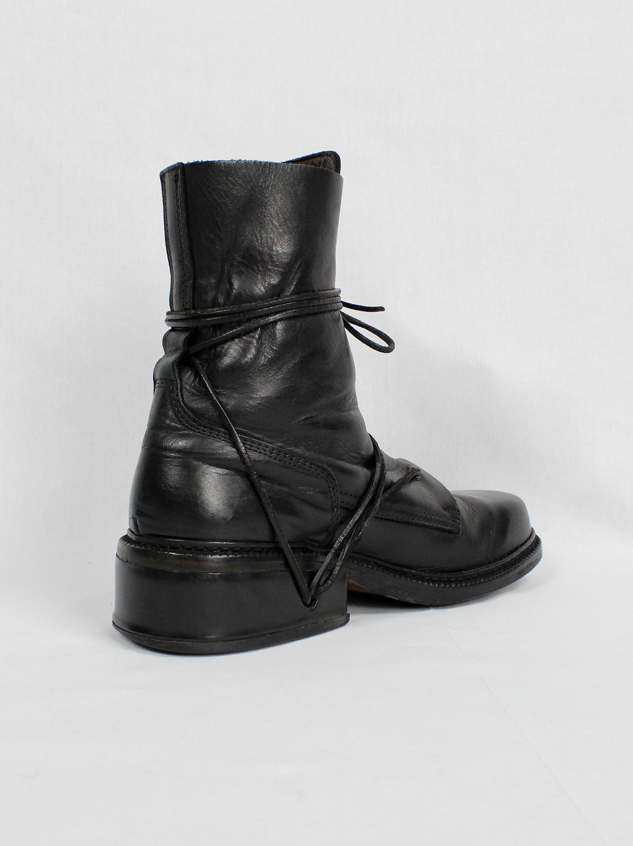 Dirk Bikkembergs black combat boots wrapped with laces through the 