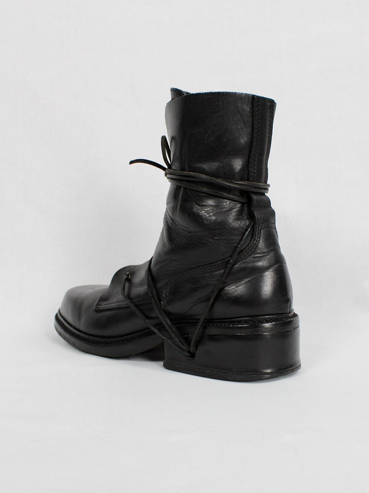 Dirk Bikkembergs black combat boots wrapped with laces through the 