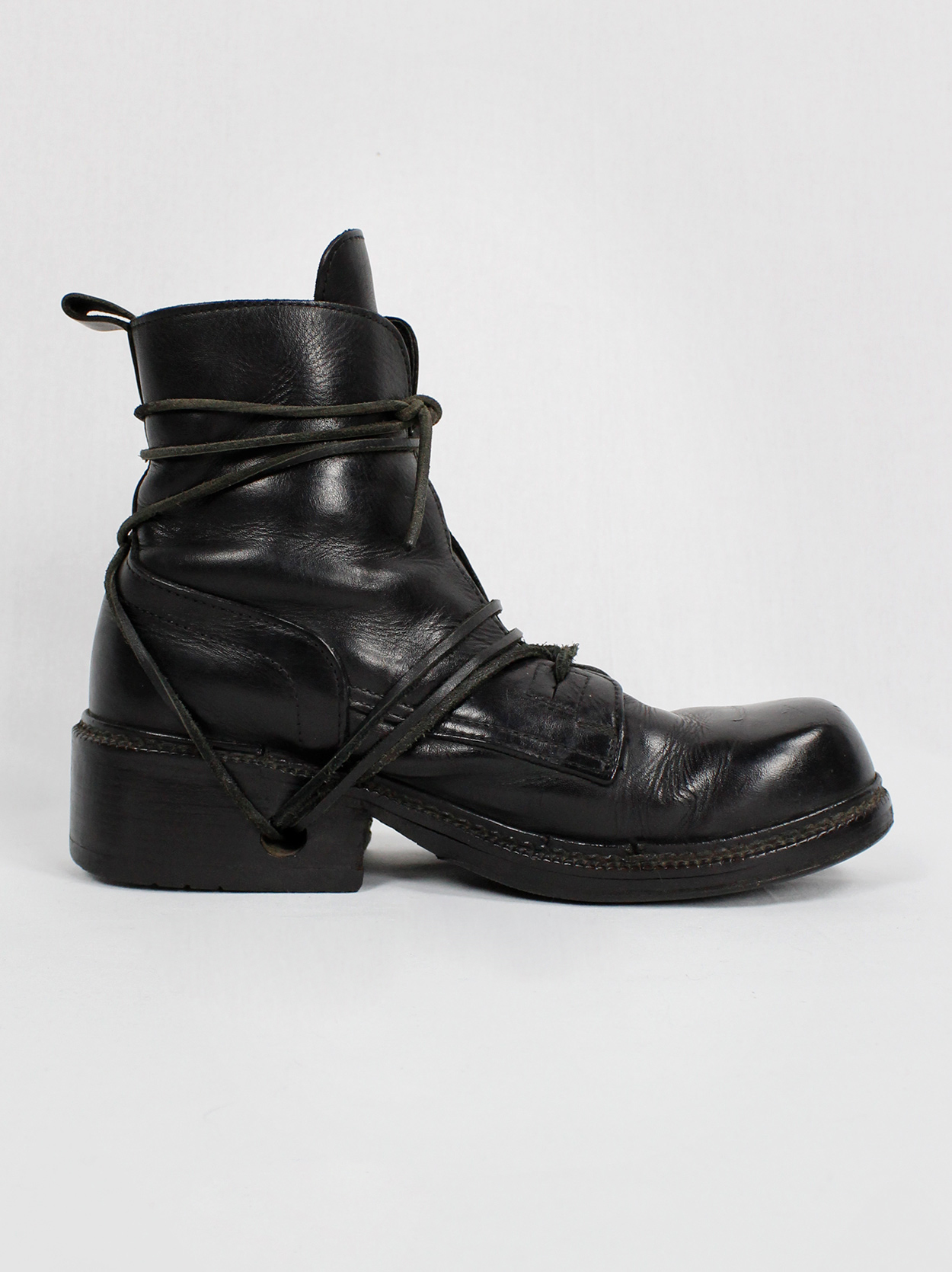 Dirk Bikkembergs black combat boots wrapped by laces through the