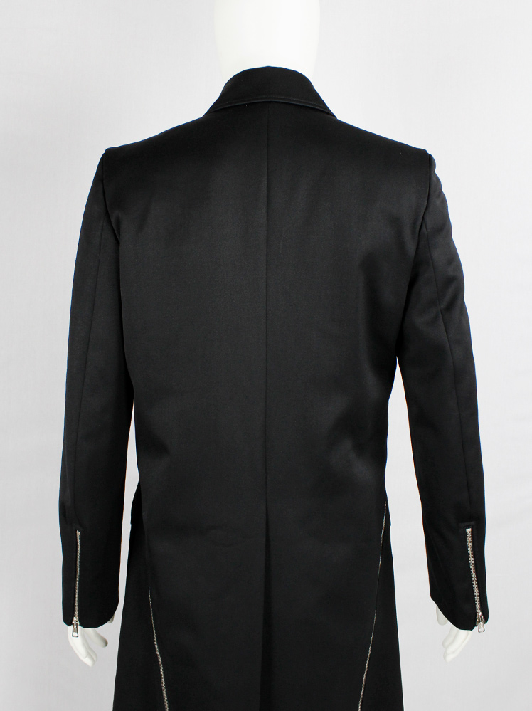 Xavier Delcour black long coat with two silver zippers going from